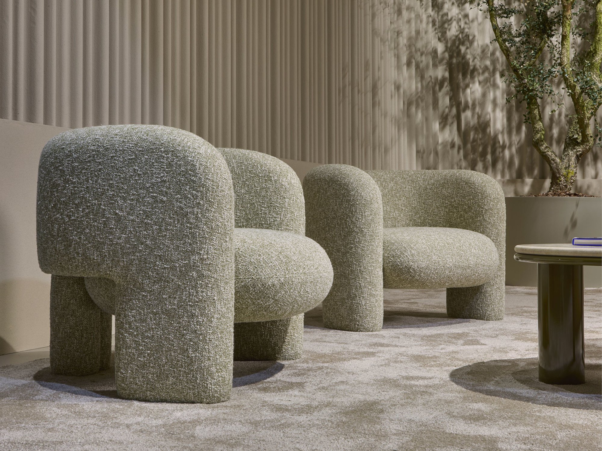 Armchairs in fabric zero by Sahco boucle' Emma